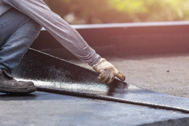Professional Waterproofing technician working in Crownsville, MD